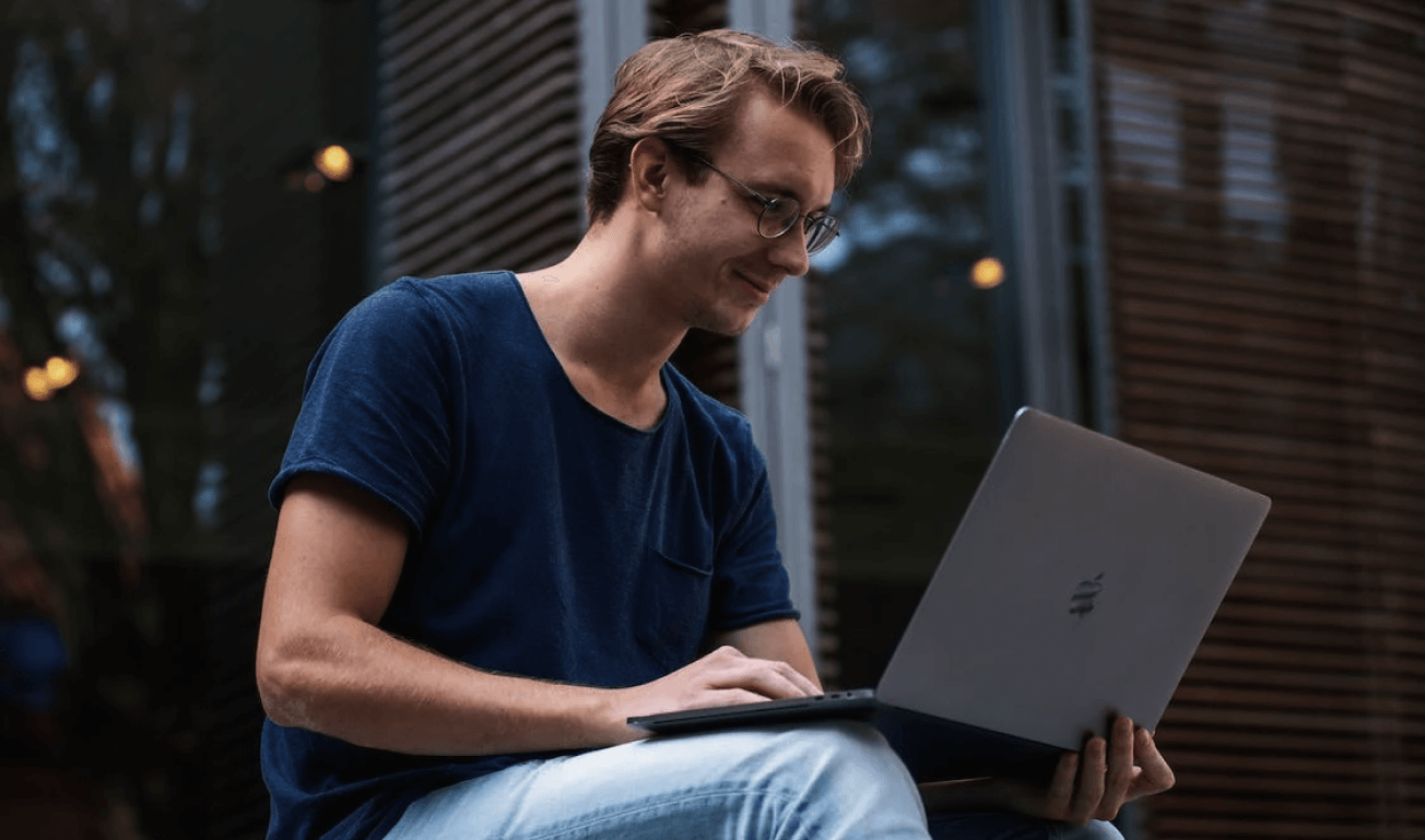 Image of a dark man sitting with an order form