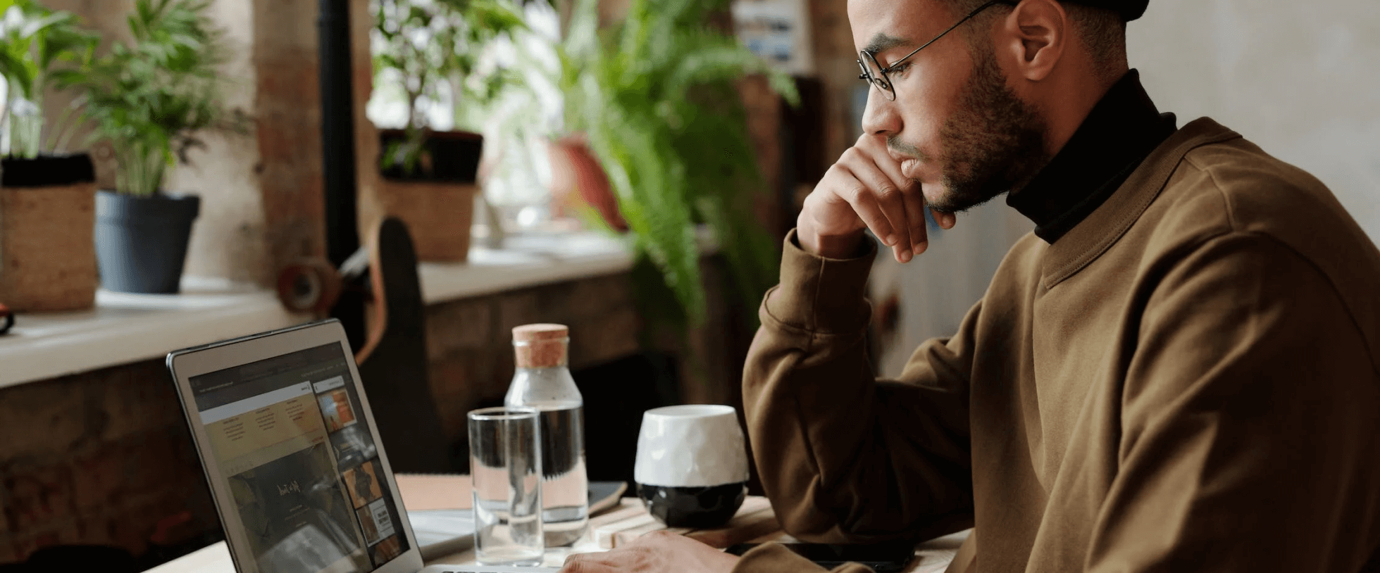 Image of a dark man sitting with an order form